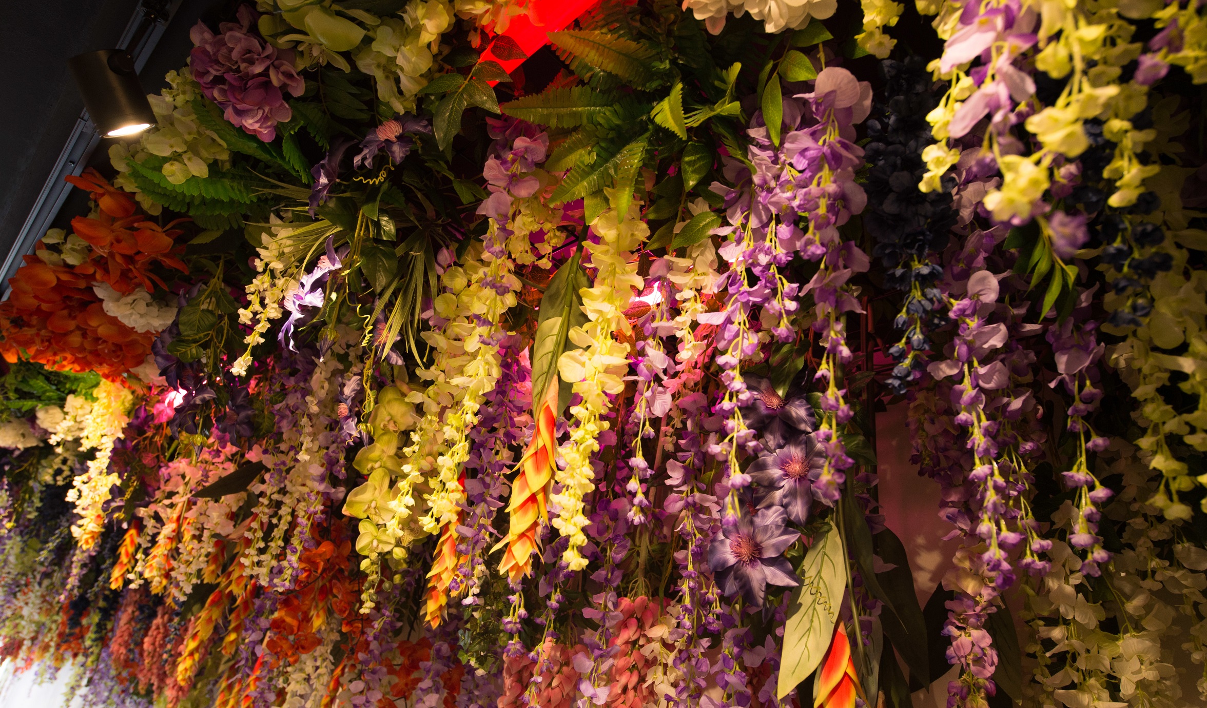 Hanging flowers adorn Diptyque's pop-up space