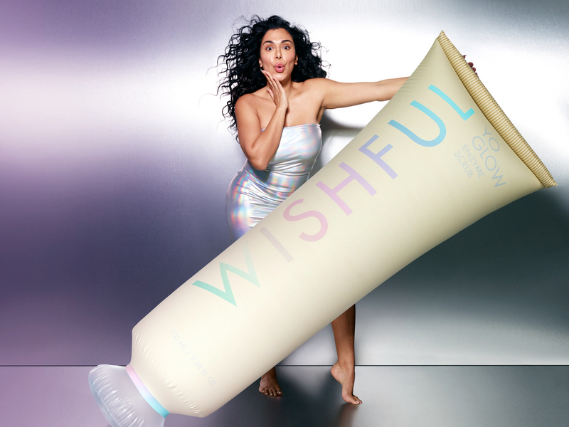 Huda Kattan with an over-sized Yo Glow Enzyme Scrub by Wishful