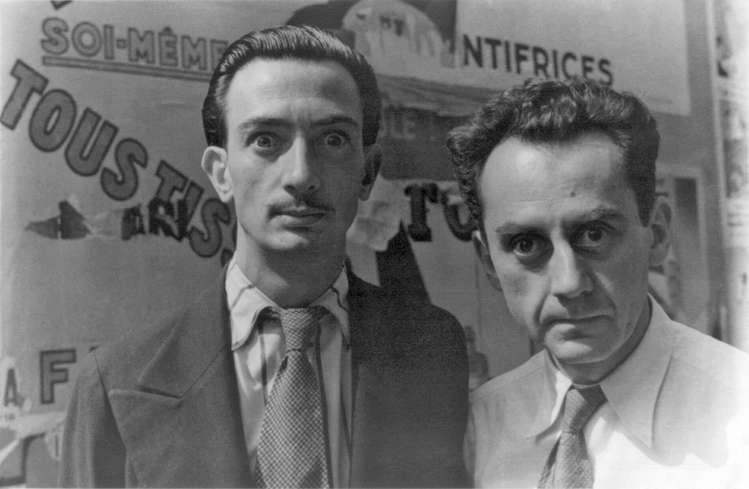 Salvador Dali and May Ray (right) in Paris making 'wild eyes' for photographer Carl Van Vechten in 1934