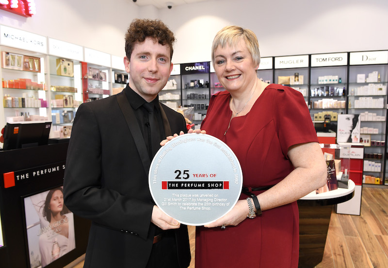 Gill Smith, Managing Director presenting Will Marshall, Store Manager for The Perfume Shop, Birmingham Bullring with the 25th anniversary silver plaque. 
