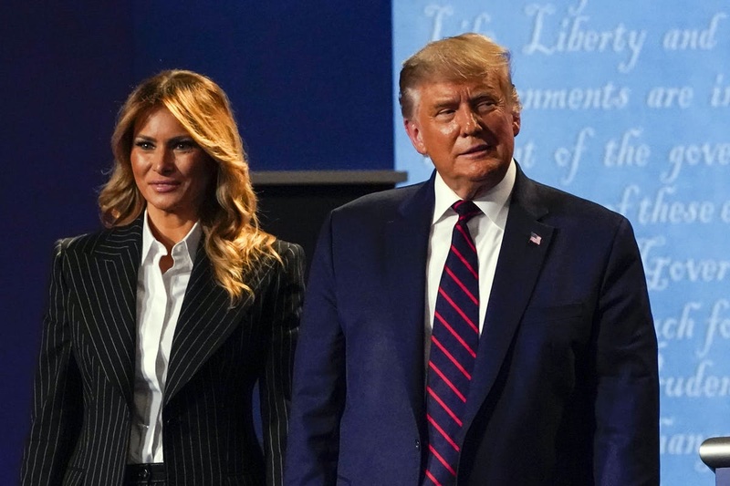 G-III is the fashion brand behind the Trump's Signature Tie collection / Pictured with wife Melania